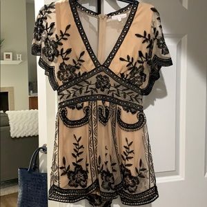 Black and beige detailed romper
